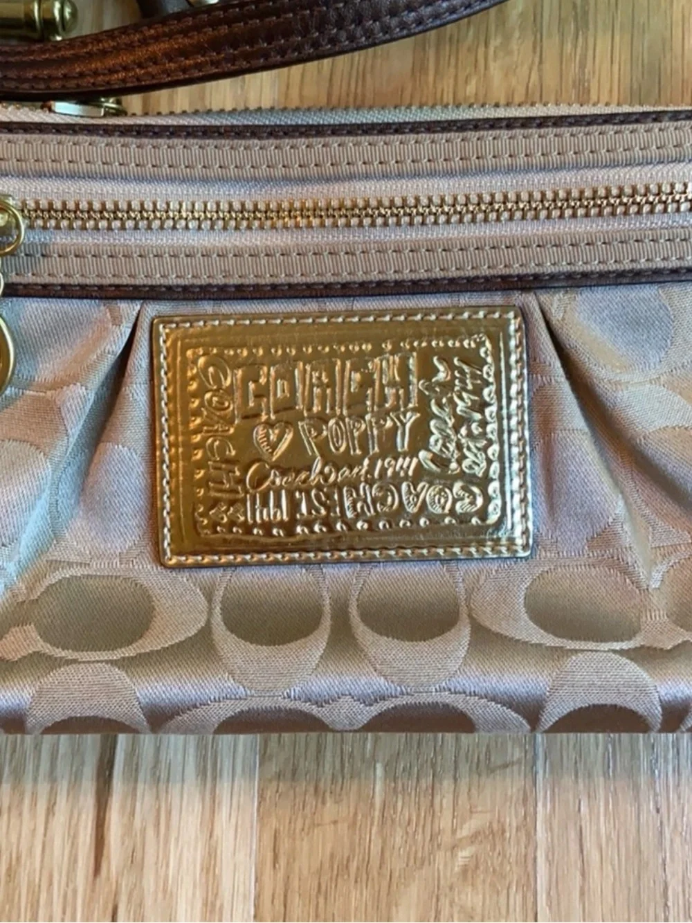 Coach Beige Signature Wristlet Pouch with Gold Logo Plaque